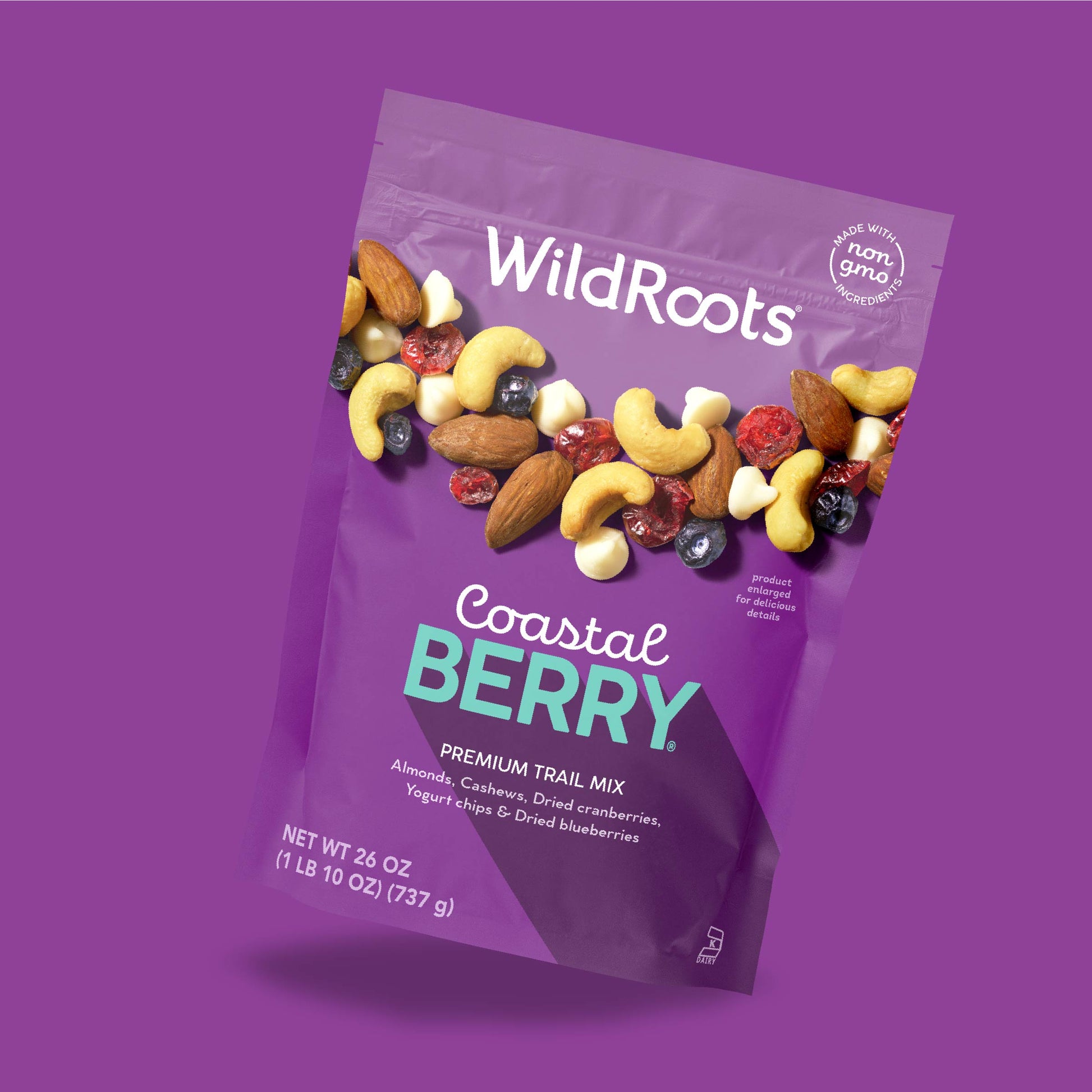 A purple bag of WildRoots Coastal Berry Premium Trail Mix, featuring a photo of mixed nuts and berries on the front, set against a solid purple background.